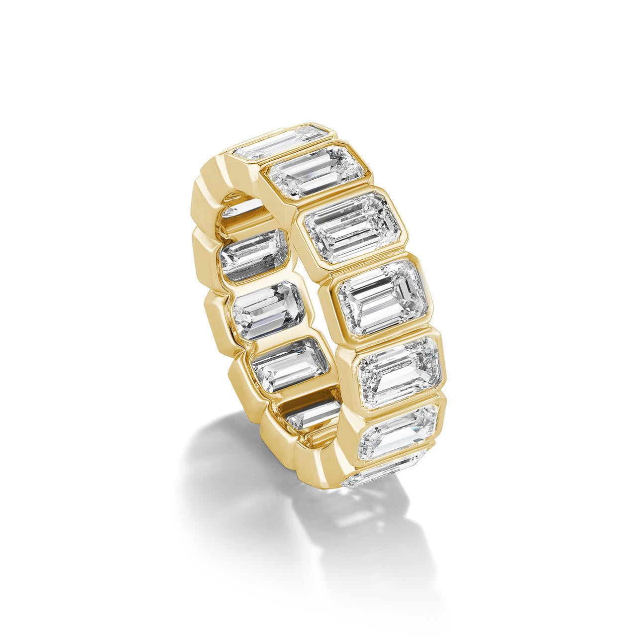 Bezel-set-emerald-cut-diamond-eternity-band-yellow gold
