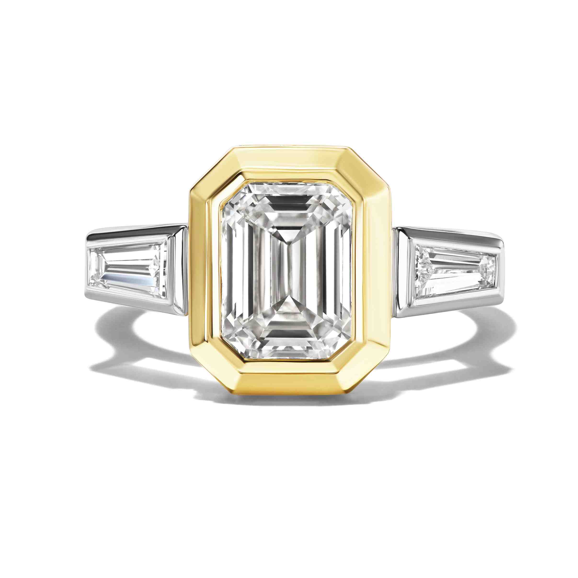 SHIELD BEZEL SET EMERALD CUT ENGAGEMENT RING WITH TAPERED BAGUETTES