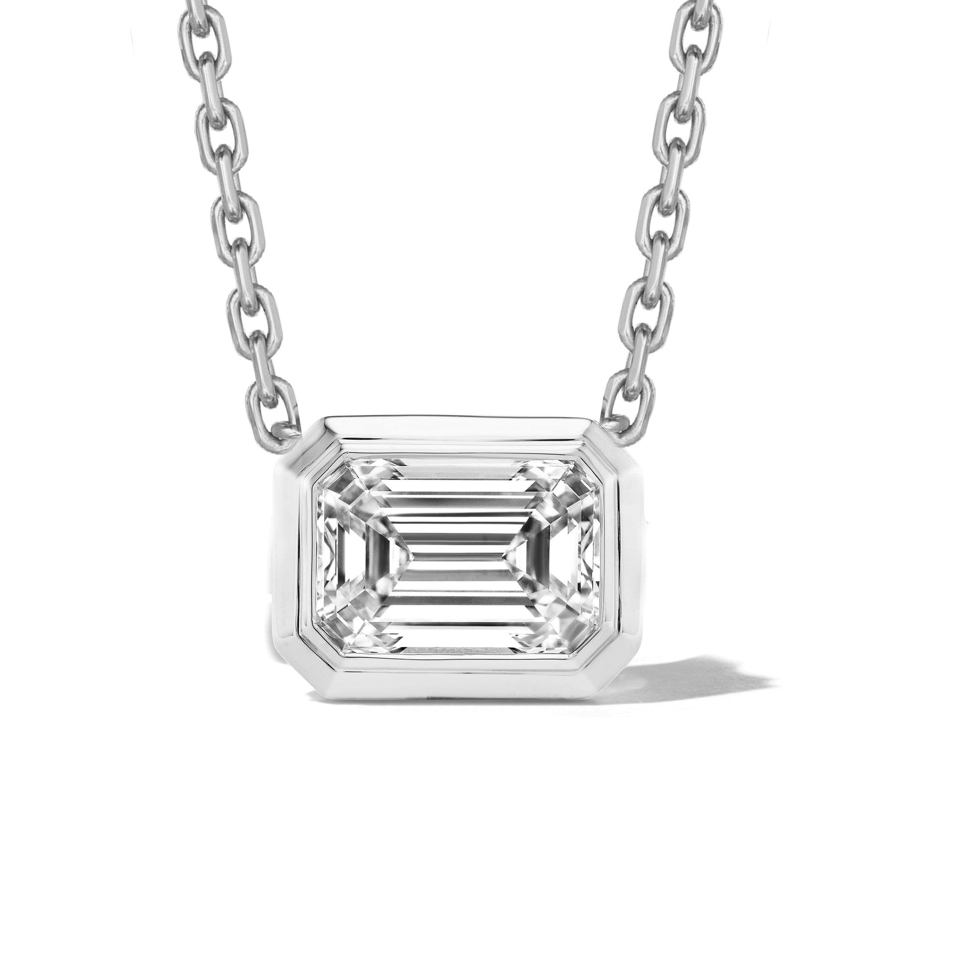 east-west-emerald-cut-diamond-bezel-set-pendant-necklace