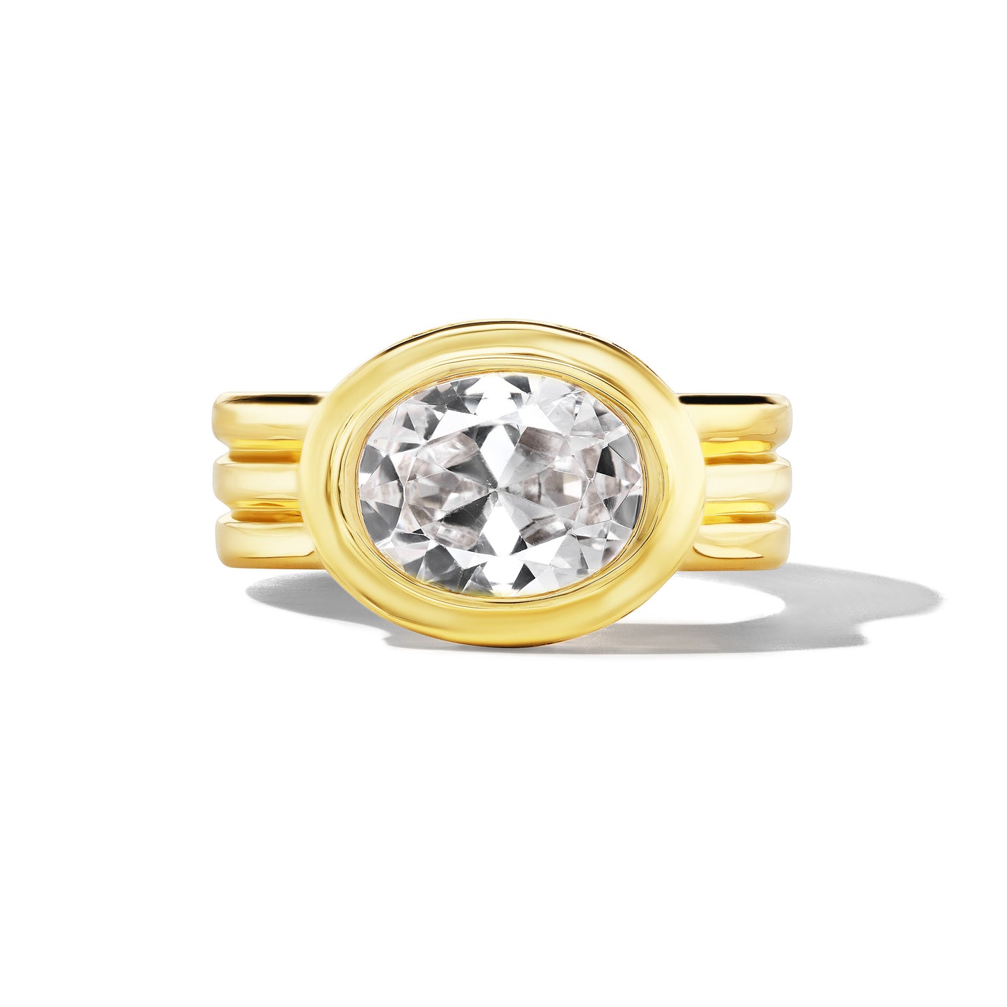 SHIELD TRIPLE TRUMPET BEZEL SET EAST WEST OVAL DIAMOND ENGAGEMENT RING