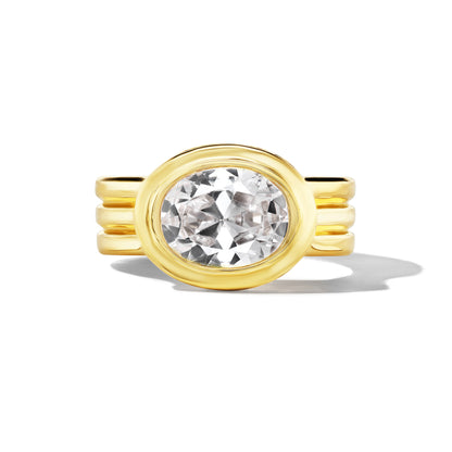 SHIELD TRIPLE TRUMPET BEZEL SET EAST WEST OVAL DIAMOND ENGAGEMENT RING