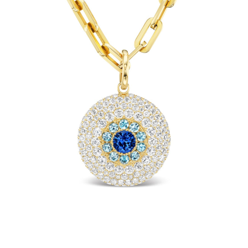 Evil eye medallion necklace with a blue and white center design on a fine chain.
