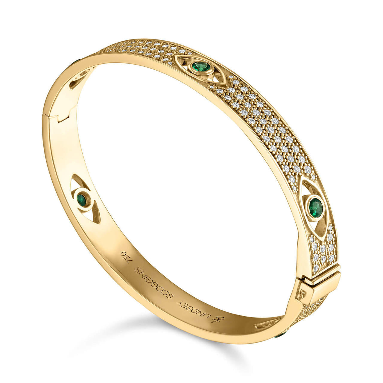 diamond and emerald evil eye bangle in 18k yellow gold