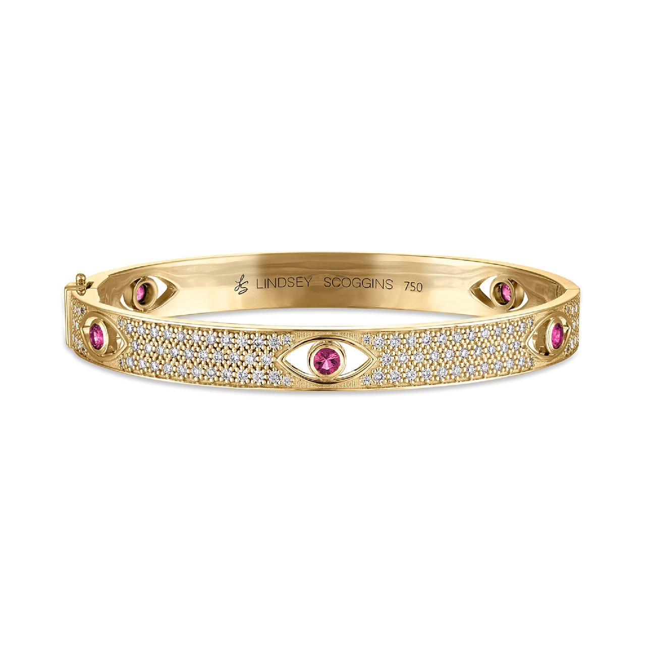 diamond and emerald evil eye bangle in 18k yellow gold