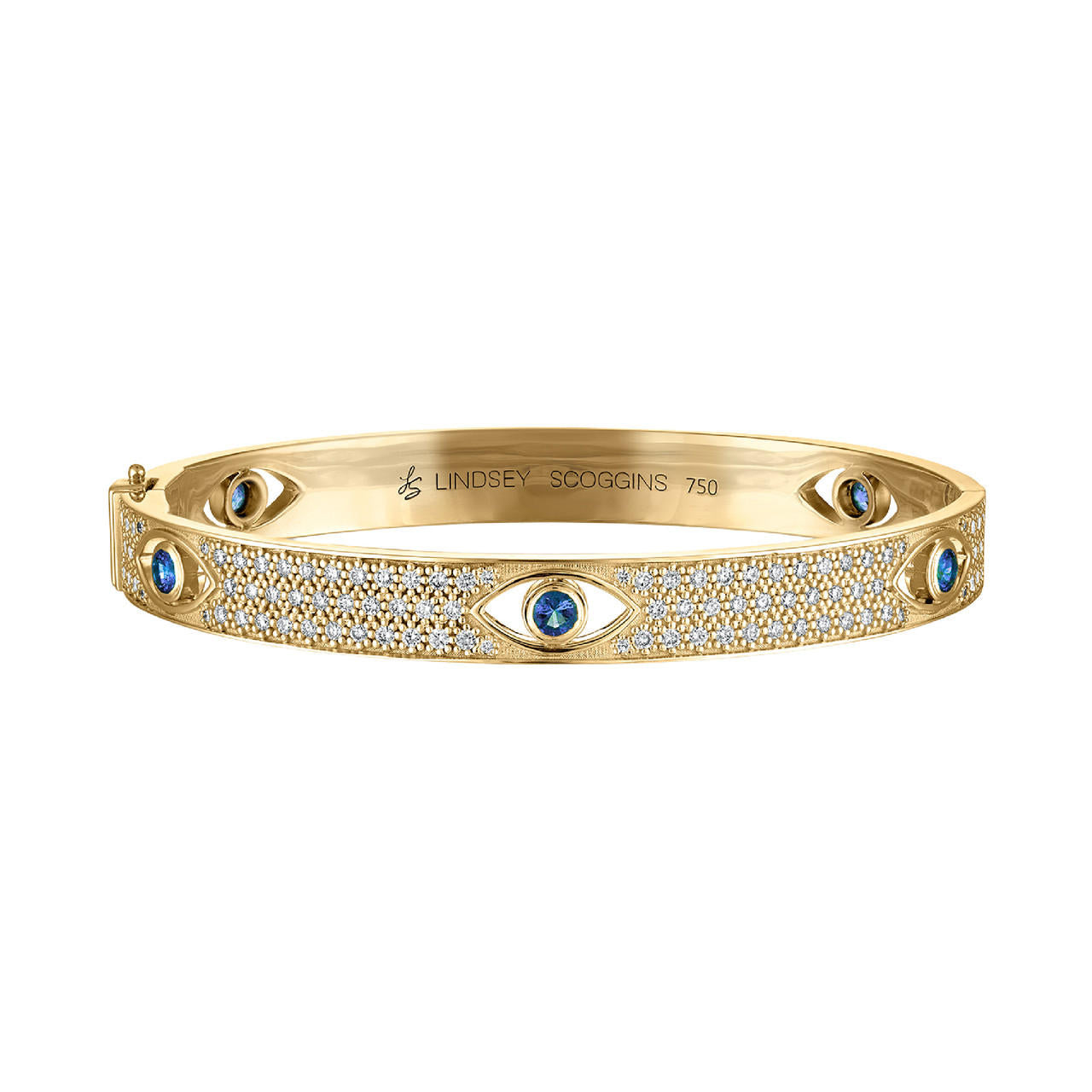 diamond and emerald evil eye bangle in 18k yellow gold