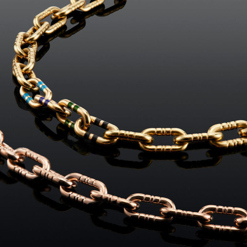 mega capsule link bracelet in 18k gold with enamel stripes and mega capsule link bracelet in 18k rose gold with engraved stripes; enamel chain link bracelet