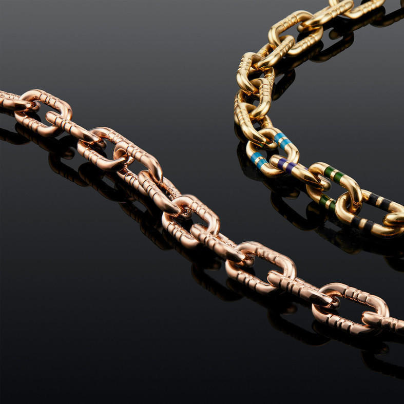 mega capsule link bracelet in 18 karat rose gold with engraved stripes and in 18 karat yellow gold with enamel stripes; rose gold link bracelet