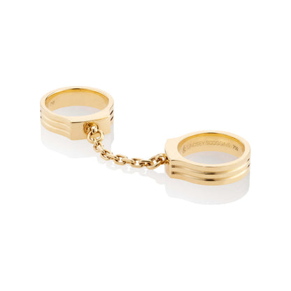 oath double finger ring with chain set in yellow gold with chain detail stacked