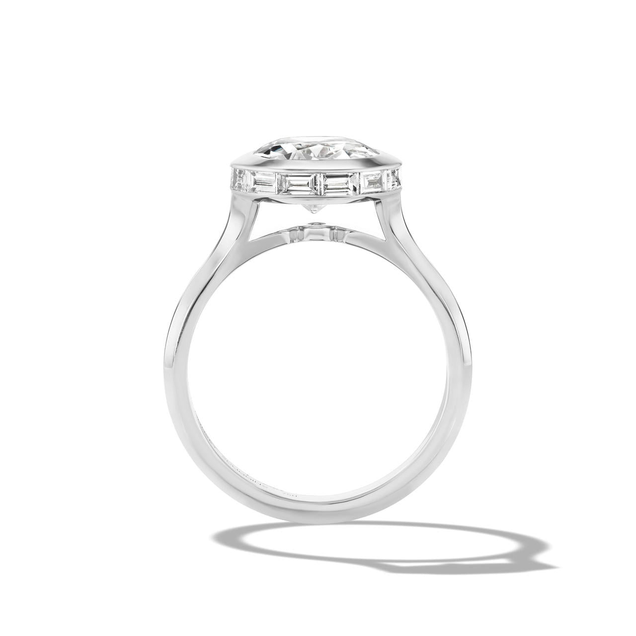 shield bezel set oval diamond engagement ring in platinum
