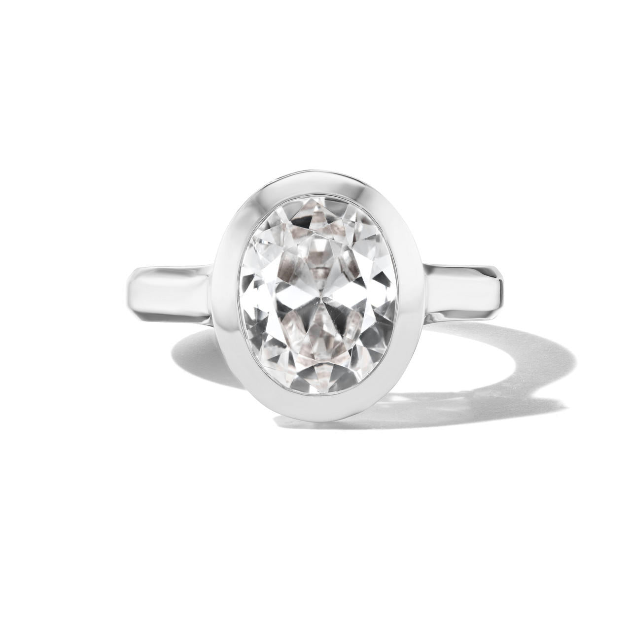 shield bezel set oval diamond engagement ring in platinum