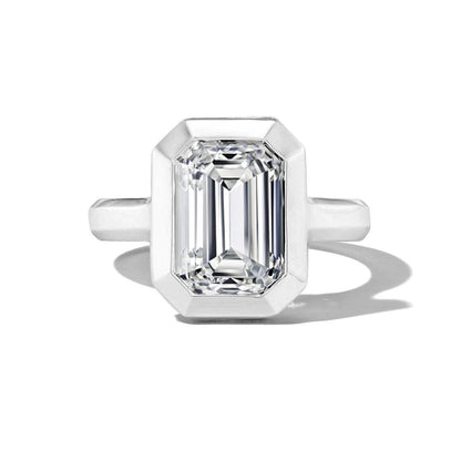 SHIELD BEZEL SET EMERALD CUT DIAMOND ENGAGEMENT RING IN PLATINUM