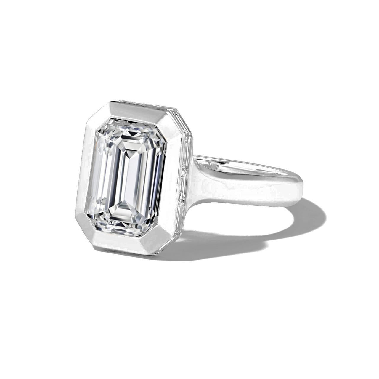 shield bezel set emerald cut diamond engagement ring in platinum