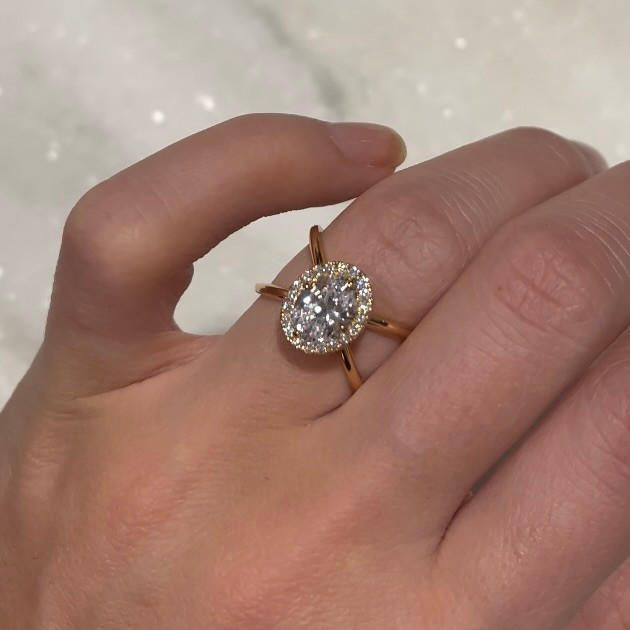 OVAL CUT DIAMOND ENGAGEMENT RING WITH A WRAPPED HALO AXIS SETTING IN 18K ROSE GOLD