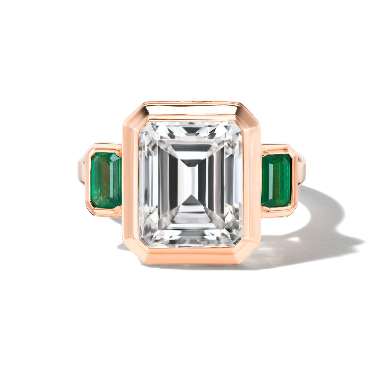 shield emerald cut diamond three stone ring in 18k rose gold
