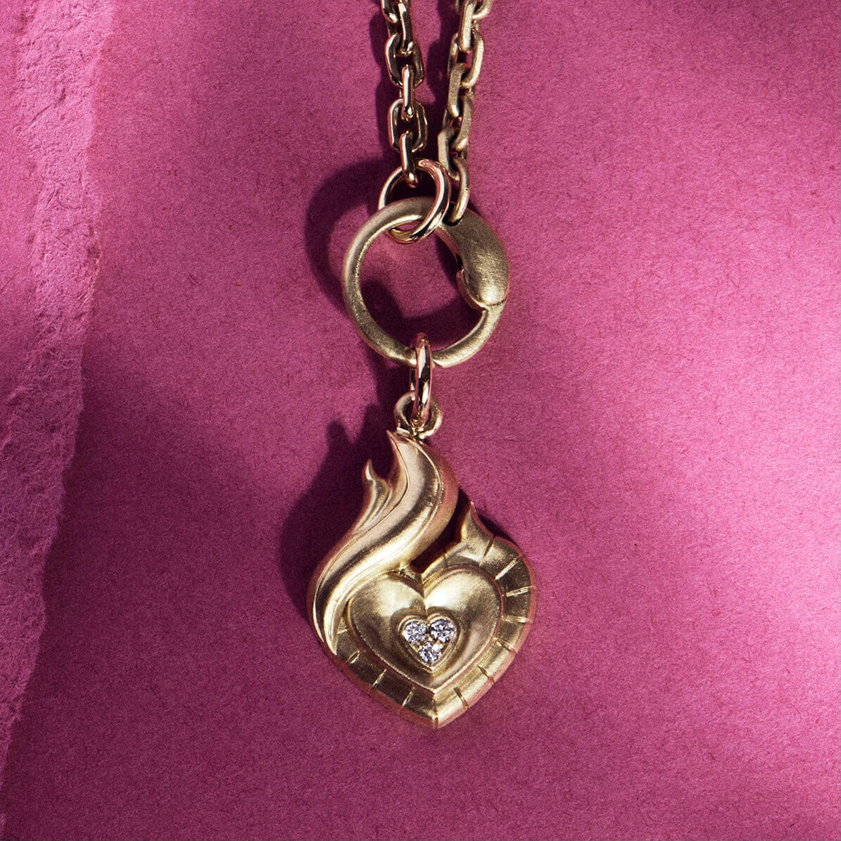 The FLAME diamond and gold pendant styled