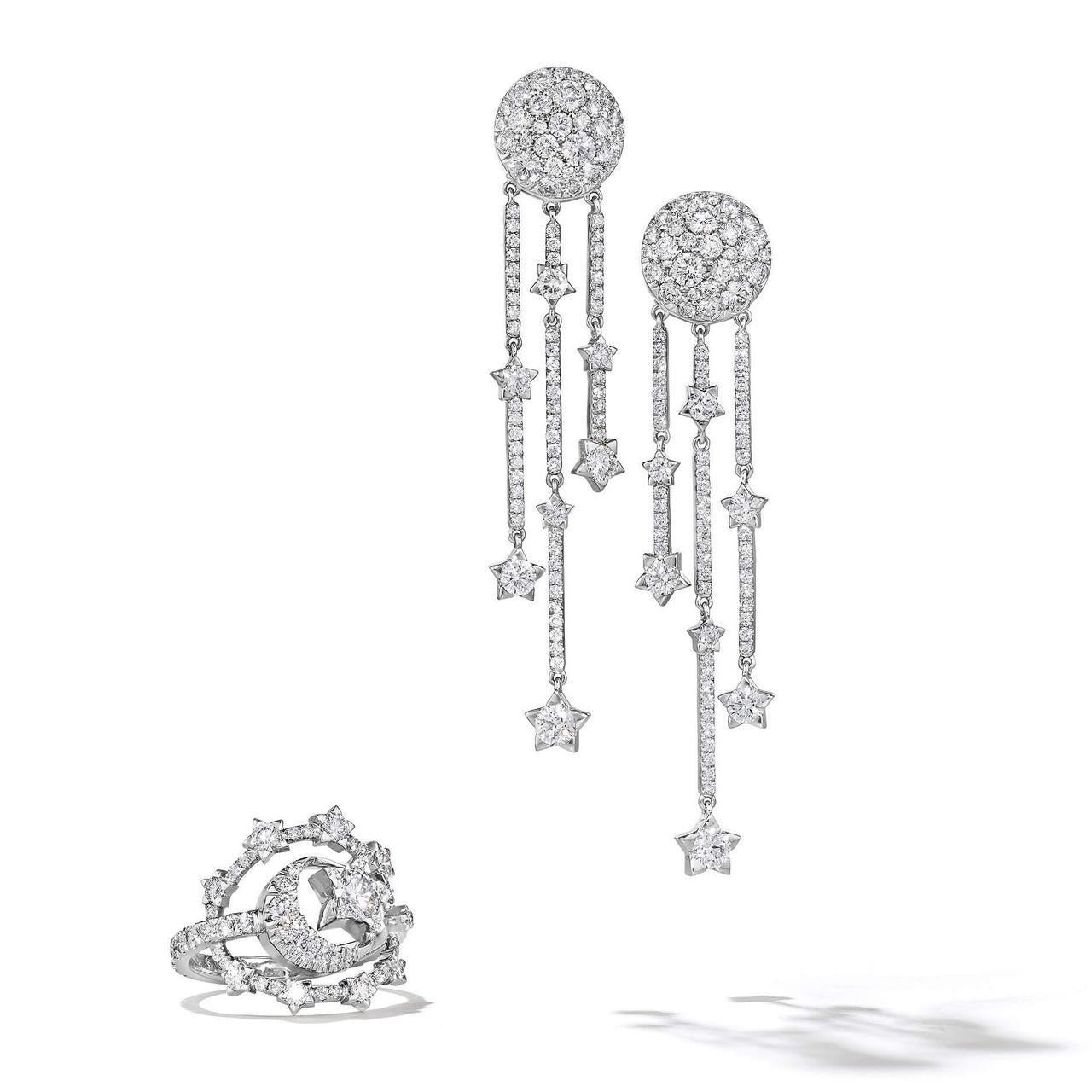 diamond and gold star and moon ring in white gold and earrings