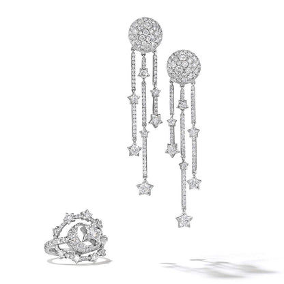 diamond and gold star and moon ring in white gold and earrings