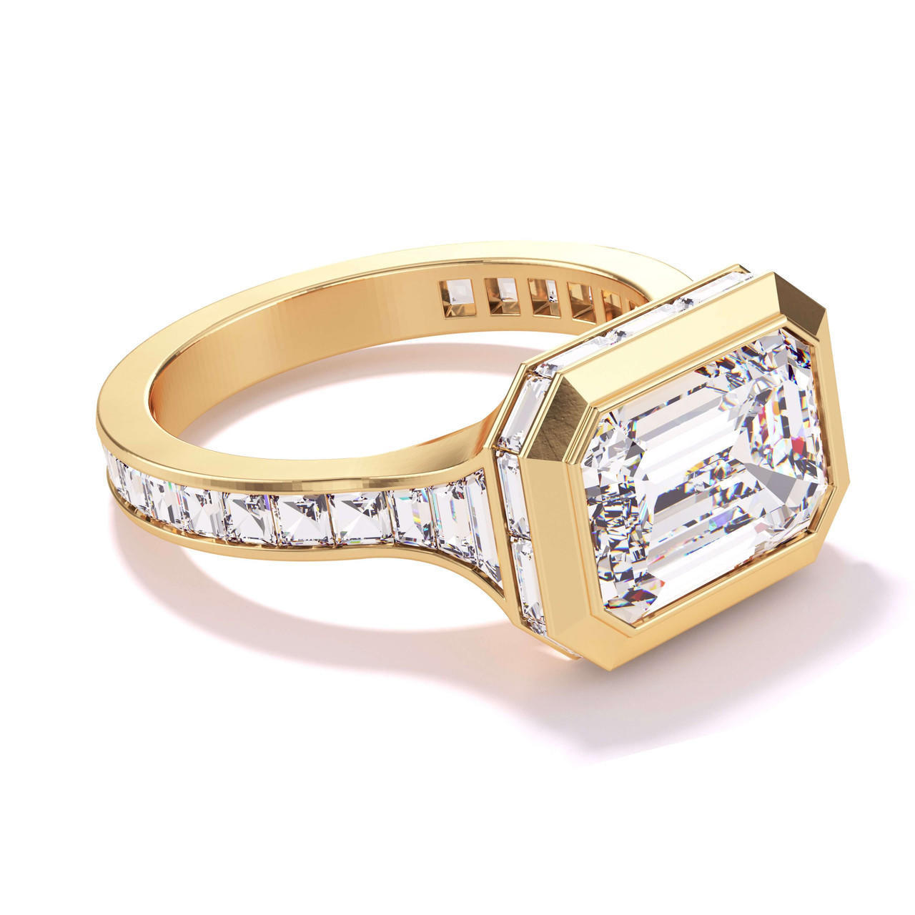 SHIELD BEZEL SET EAST WEST EMERALD CUT ENGAGEMENT RING WITH BAGUETTE DIAMOND HALO AND BAND IN 18K YELLOW GOLD