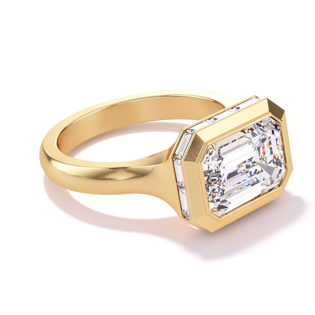 Bezel set east west emerald cut diamond ring