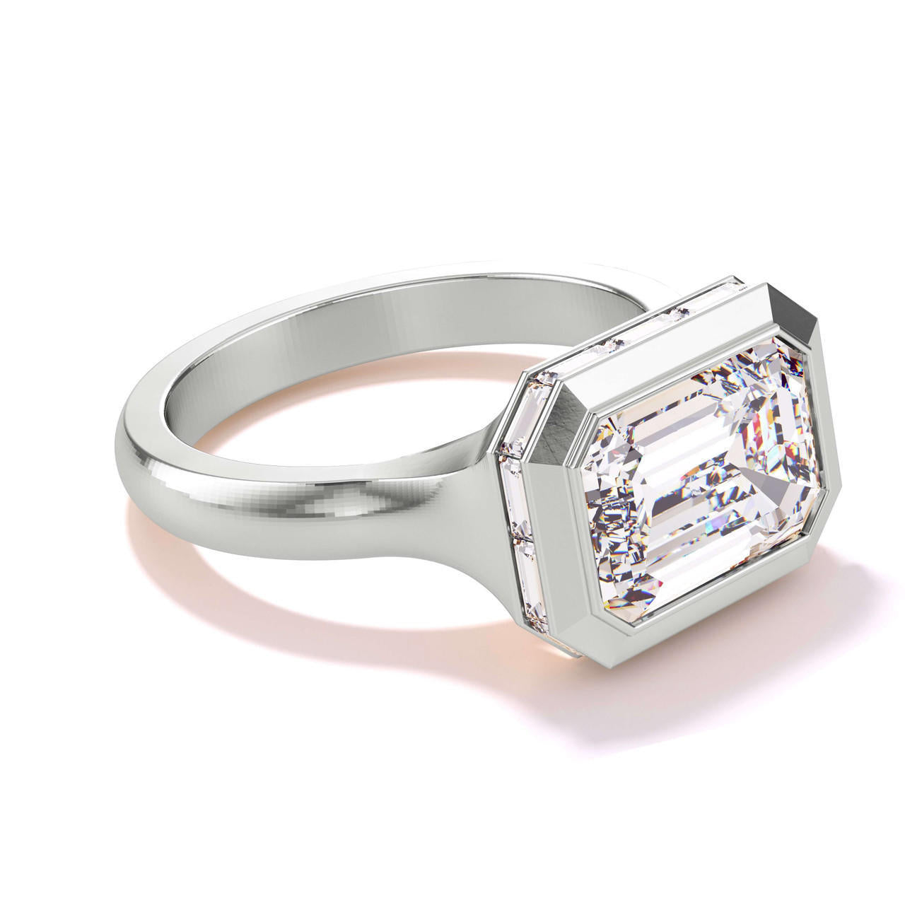 shield bezel set east west emerald cut engagement ring with halo in platinum