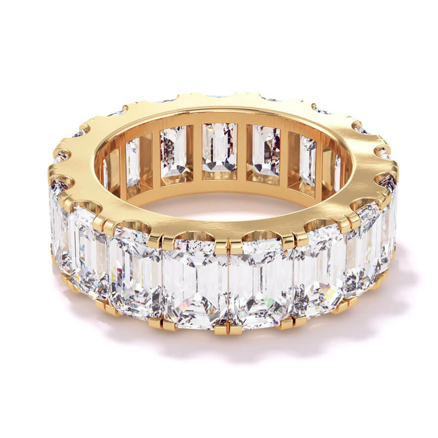 Emerald cut, baguette, and round diamond hinged bangle in 18 karat yellow gold