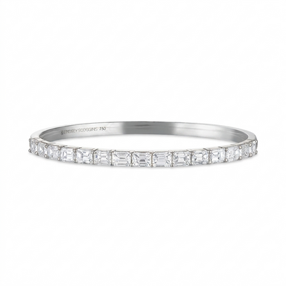 Platinum bracelet with diamond accents on a white background