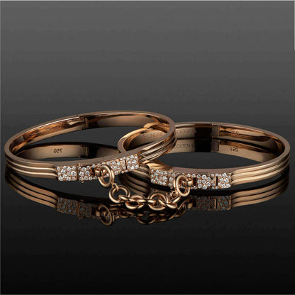 triple secure oath handcuff bangles in 18 karat rose gold with pave diamond accents on the latches; double cuff bracelet