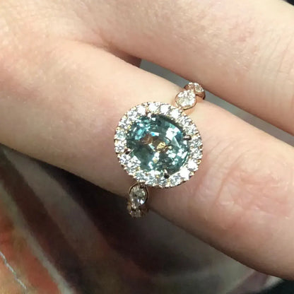 BESPOKE GREEN SAPPHIRE AND DIAMOND ENGAGEMENT RING