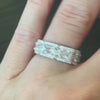 Links Emerald-Cut Diamond and Pave Eternity Band, modeled on a hand.
