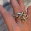 Close-up shot of a woman wearing Emerald and Diamond Snake Rings, available at Lindsey Scoggins Studio.