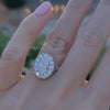 An Oval Diamond Galaxy Engagement Ring, modeled on a hand.