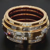 Lindsey Scoggins Studio’s Emerald-Cut and Baguette Diamond Energy Band on a dark surface.