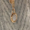 Close-up of a Pave Diamond Padlock Locket in 18K Rose Gold.