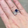 Sapphire and Diamond Toi Et moi Engagement Ring, modeled on a hand.