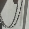 Lindsey Scoggins Studio bespoke fine jewelry emerald cut diamond tennis necklace.