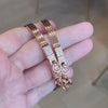 A person holding the Oath Collection Double Cuff Bracelets.