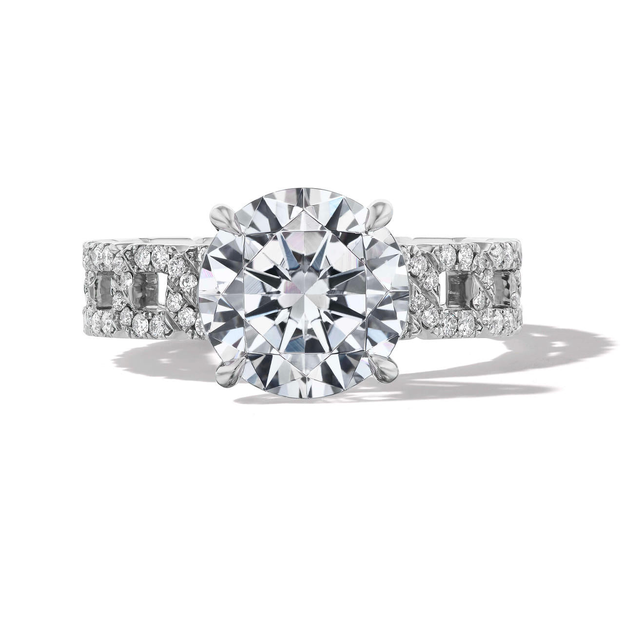 round cut diamond engagement ring with a classic 4 prong 16 pave links setting in platinum