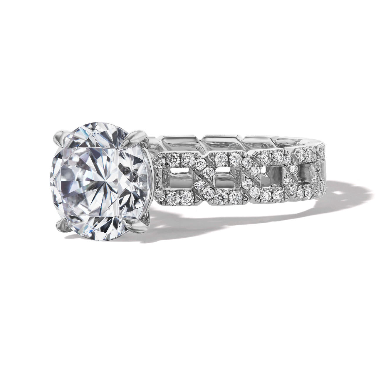 round cut diamond engagement ring with a classic 4 prong 16 pave links setting in platinum