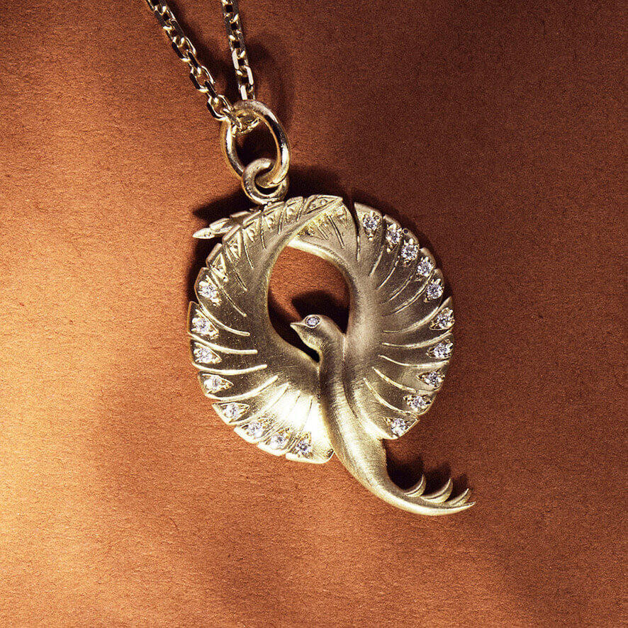 The PHOENIX diamond and gold pendant styled